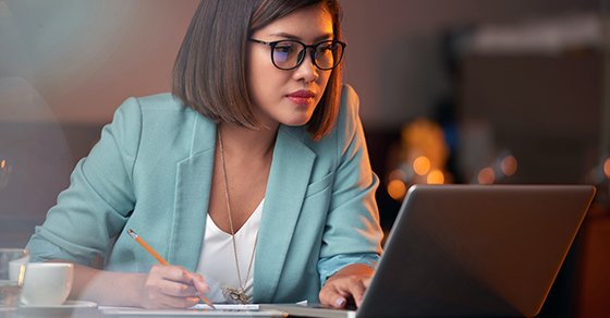 CEO updating her employee handbook on the computer